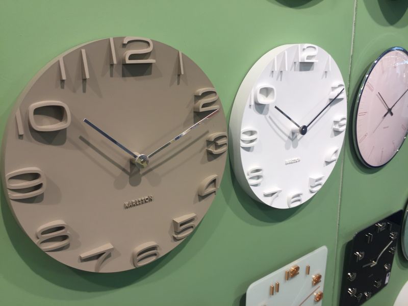 Brown and white karlsson clocks