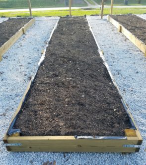 Plastic liners can be easily fitted to the inside of a raised bed before adding soil contents. 