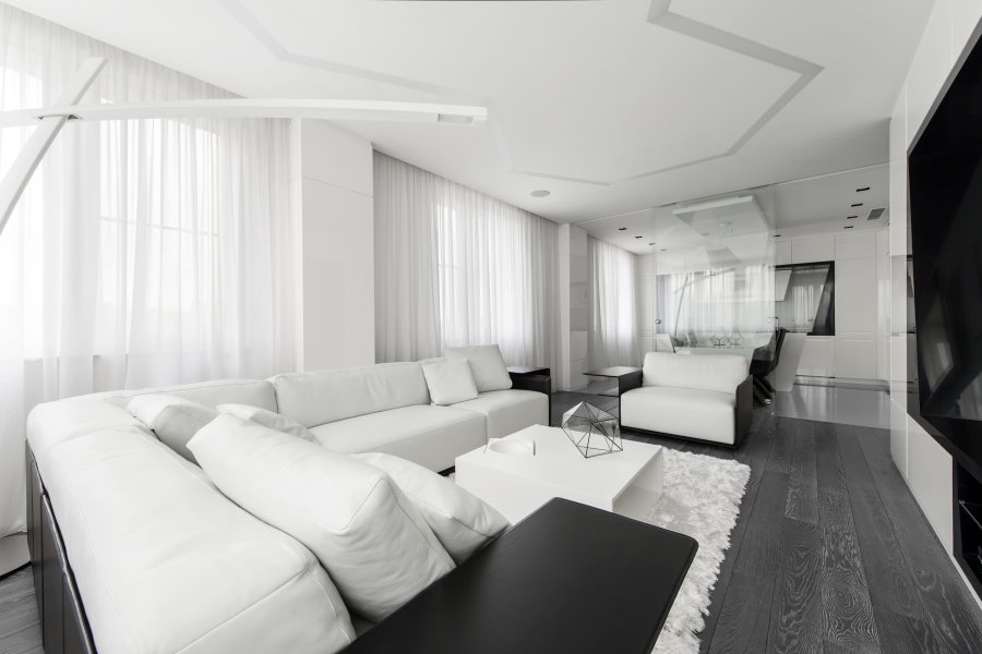 Угловой диван белого цвета в стиле хай-тек