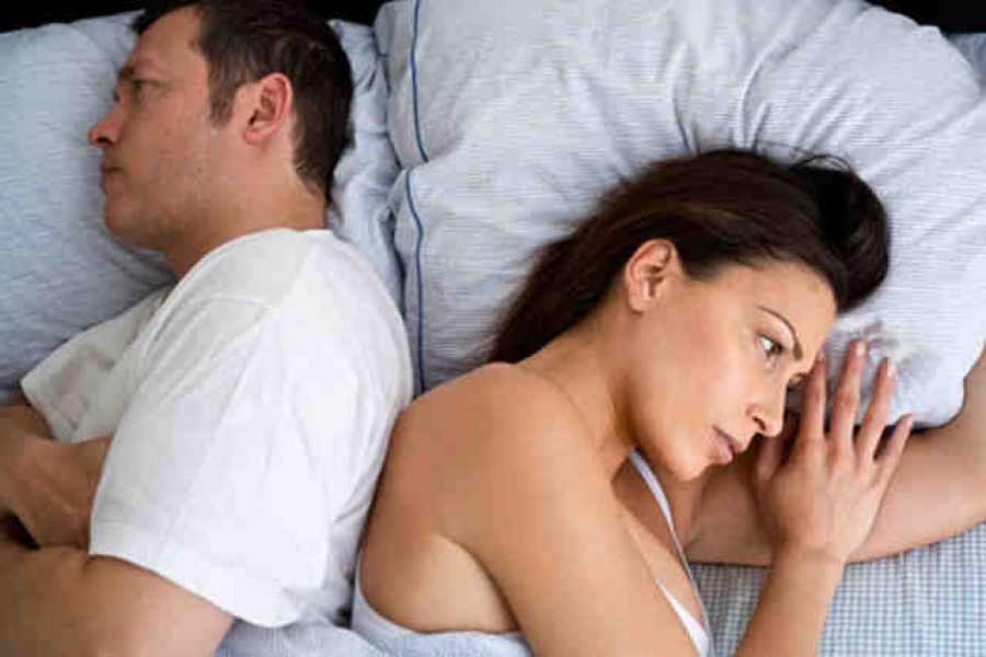 Young couple at home in bed